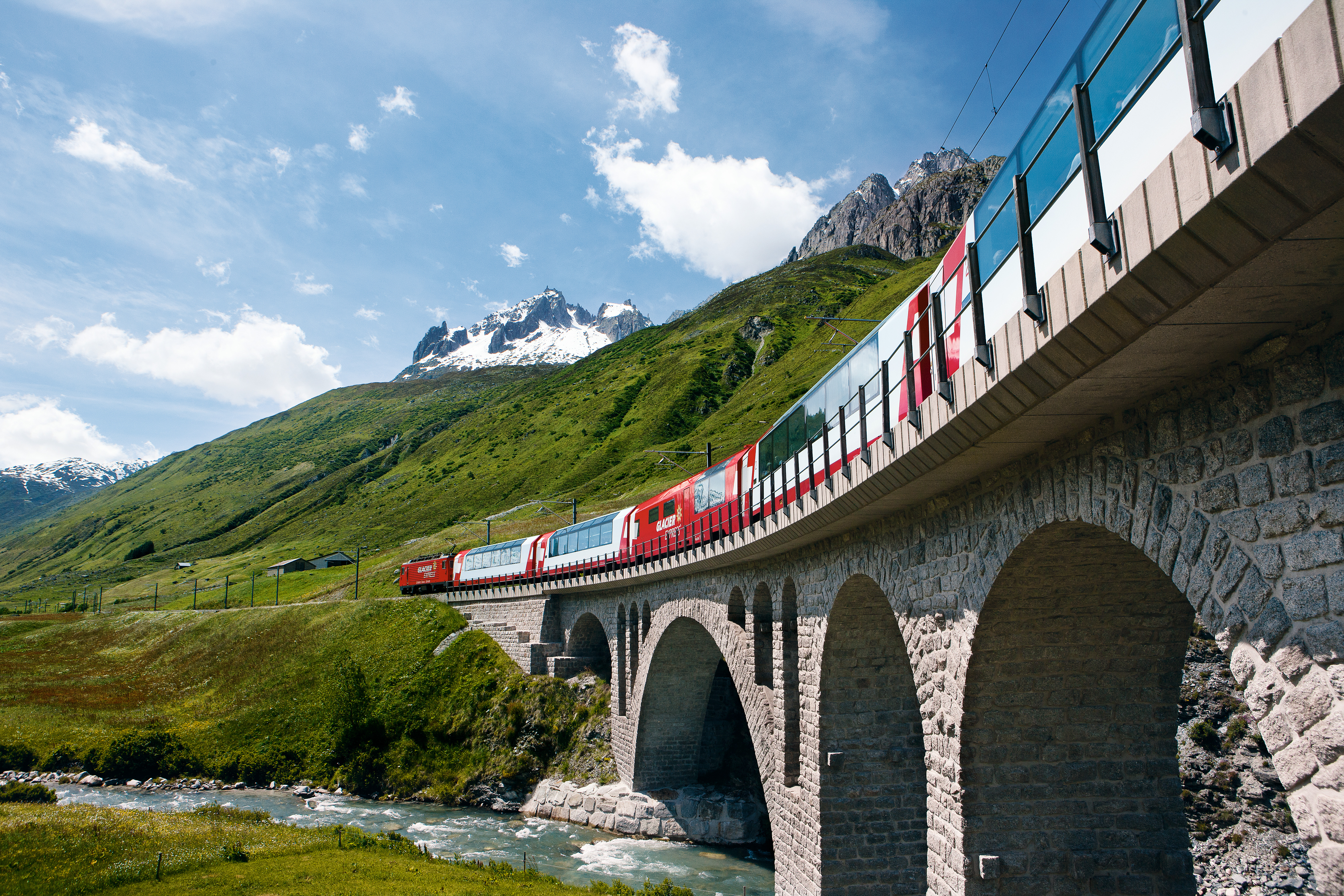 Glacier Express travelling through the Swiss Alps